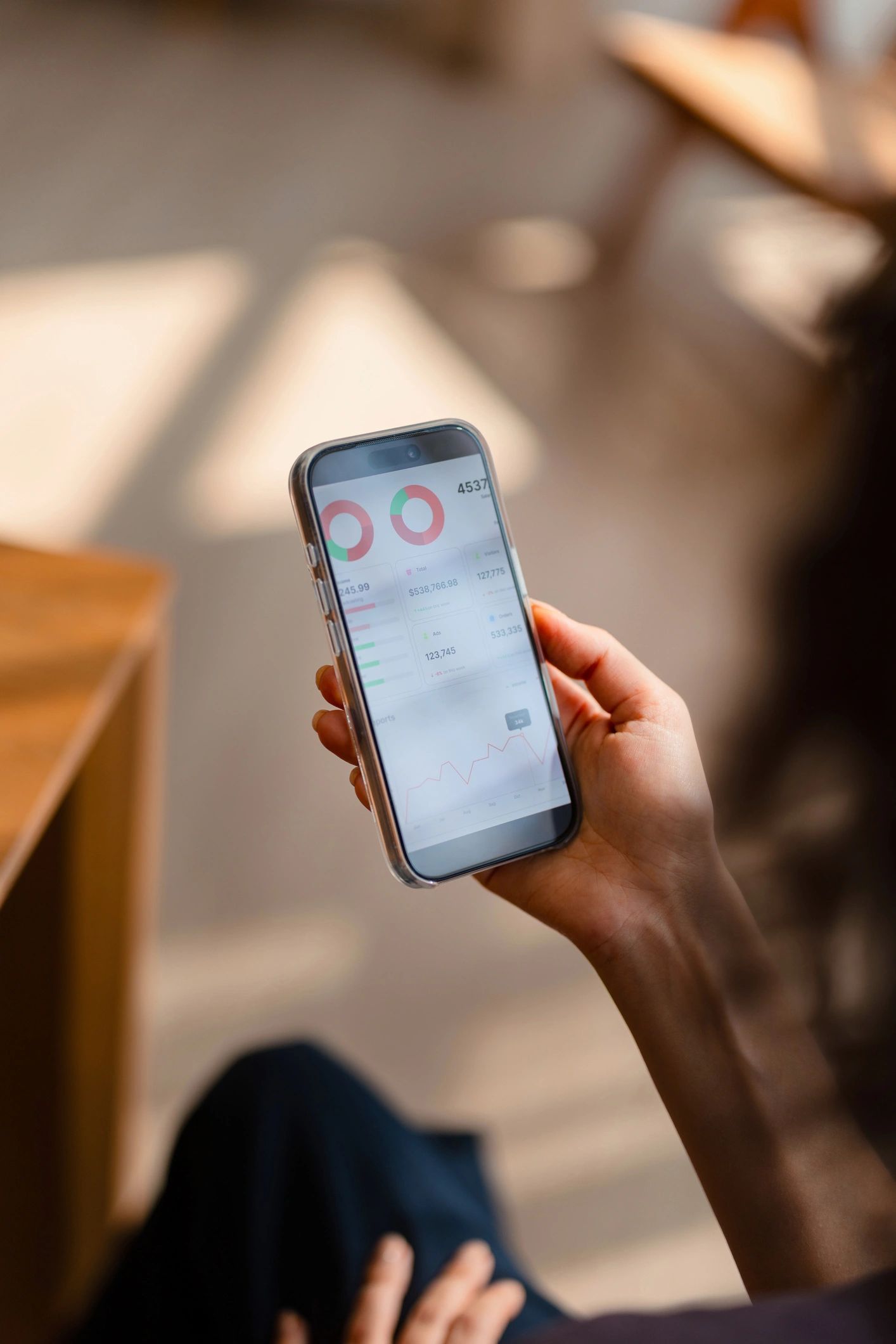 Smartphone displaying finance and app data